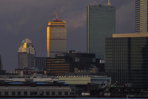reflection boston skyline architecture sunrise hancocktower prudentialbuilding bostonskyline bostonharbor