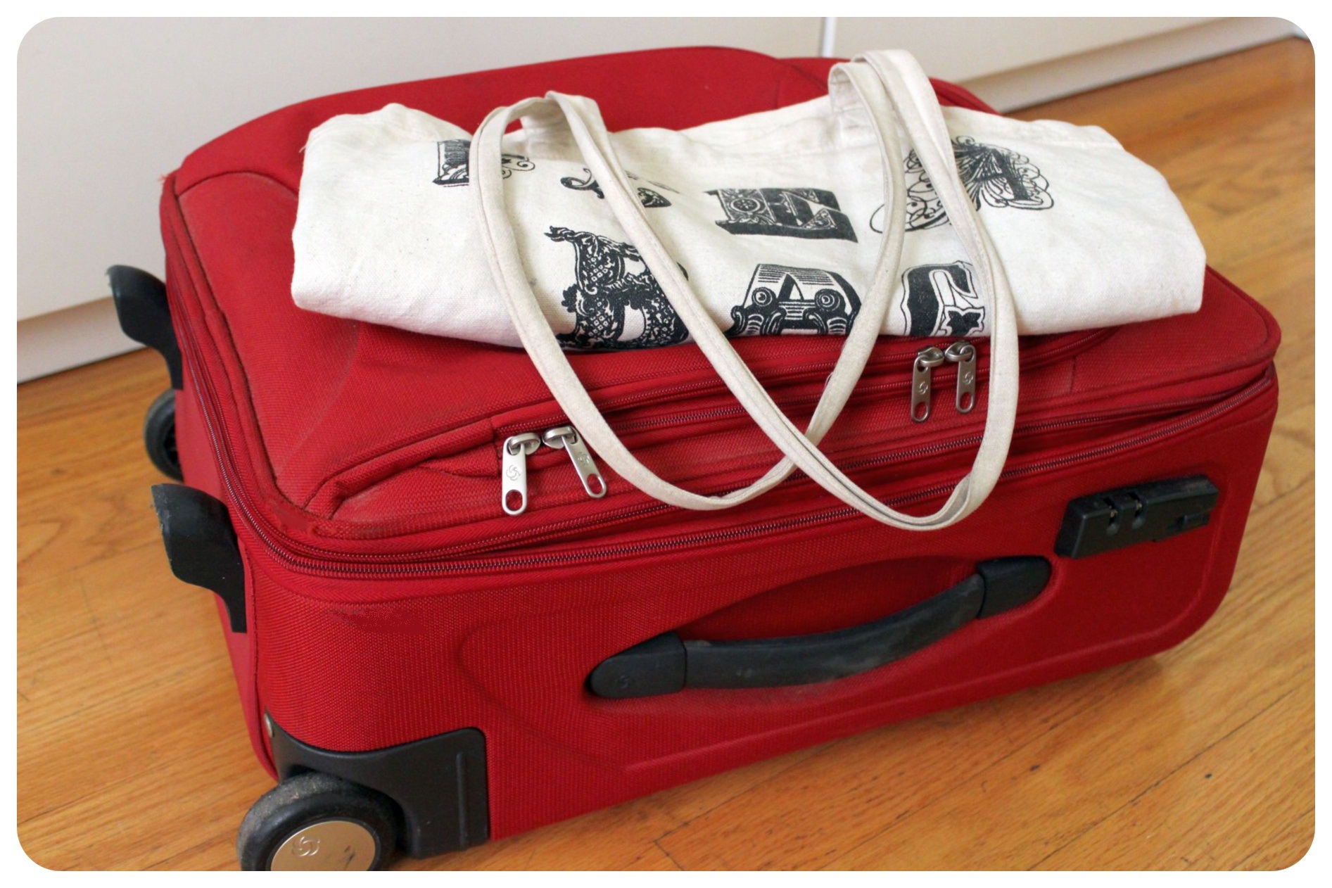 suitcase and foldable tote bag
