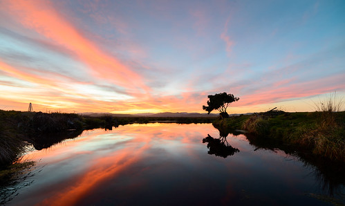 light sunset newzealand sky water clouds dusk tarn tussock napier hawkesbay