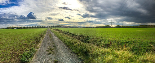 road blue trees sky panorama sunlight storm green clouds germany outside deutschland farm fields dortmund gravel northrhinewestphalia brackel iphone5s
