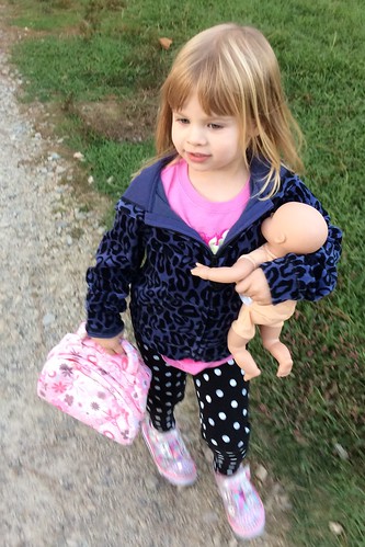 taking her baby for a walk