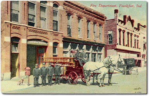horses people usa signs man color men history dogs buildings advertising awning clothing workmen indiana streetscene transportation storefronts firestation buggy buggies businesses wagons frankfort clintoncounty hoosierrecollections