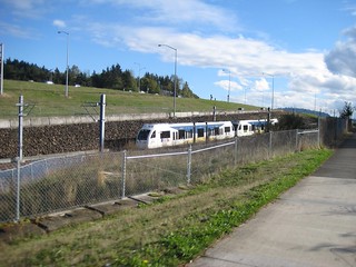 A pair of S70s approach Division St station