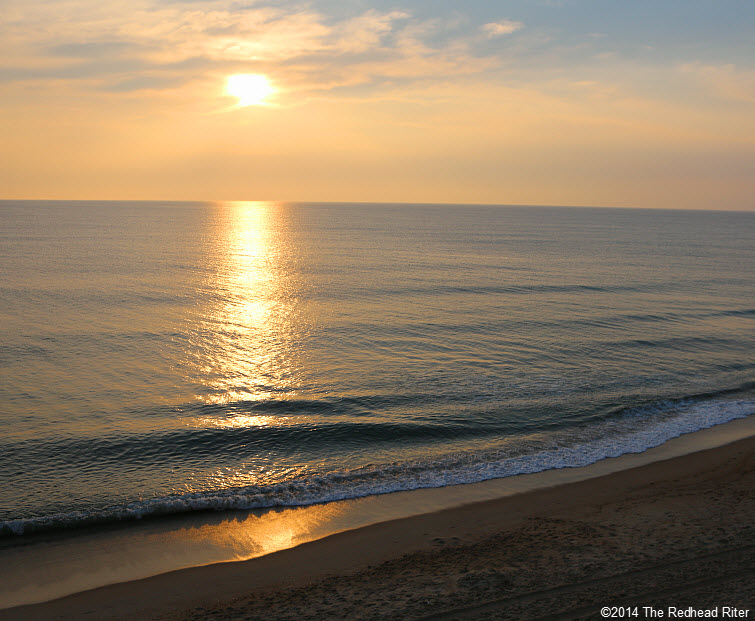 peach sunrise over the ocean on the beach new beginning