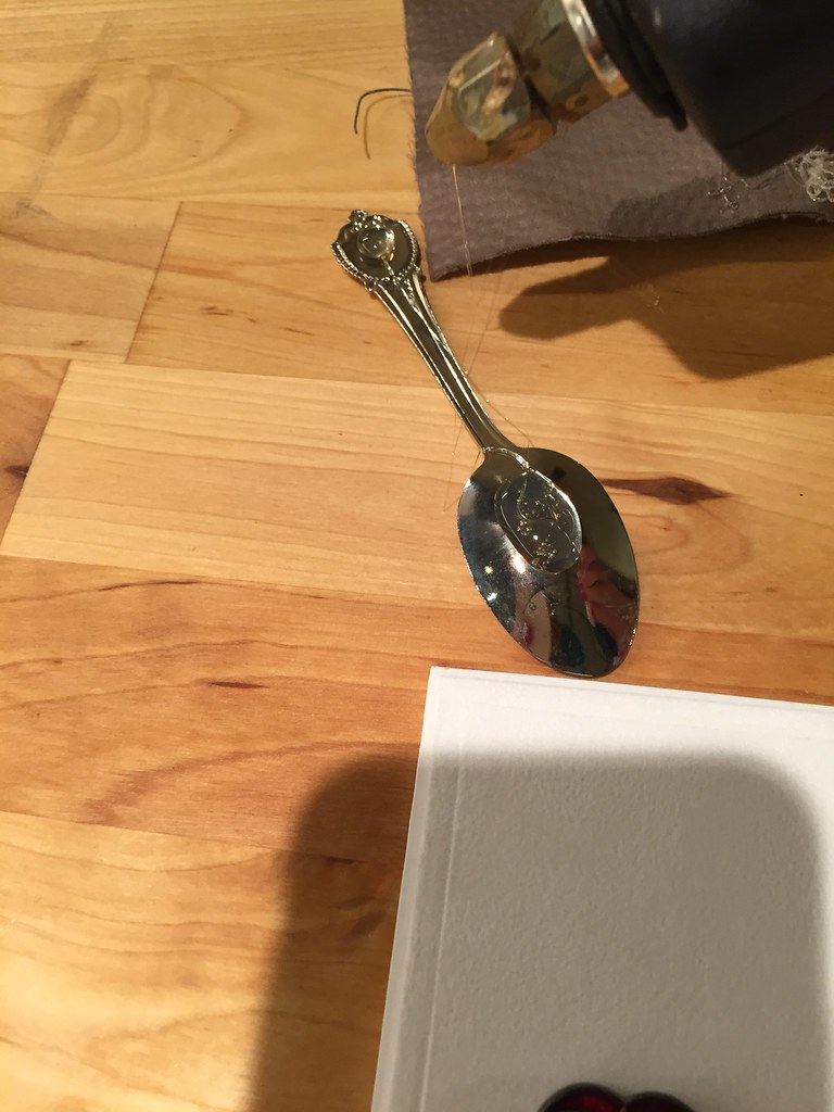 Hot gluing spoons to matboard for display