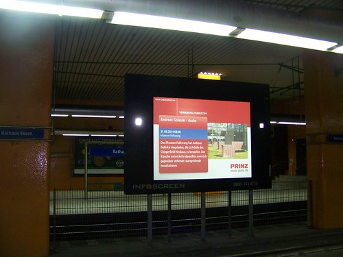 Digital screen displaying news and ads in the Hamburg U-Bahn