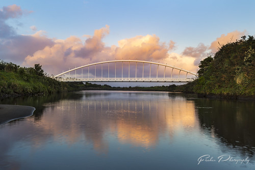 new zealand bridge te rewa plymouth sunrise sunset water river reflection nz travel explore clouds ocean coast