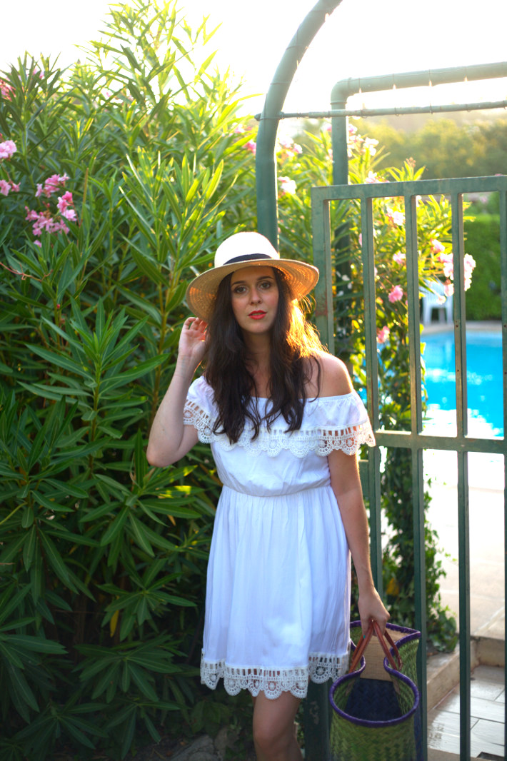 outfit: white off shoulder dress with embroidered hem and havana hat