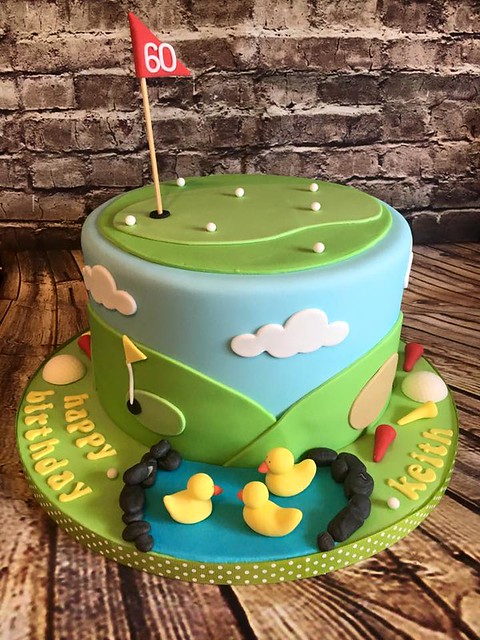 8-inch rich chocolate cake filled with chocolate buttercream, covered in ganache and decorated in a golfing theme by Cake That - Cakes by Emily