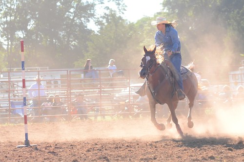 rodeo polebending cowgirl therockgeorgia georgiahighschoolrodeoassociation therockranch dust arena backlit cowboyhat