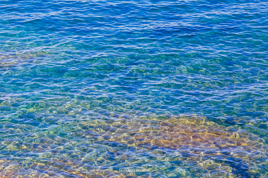 Crystal clear teal toned sea water