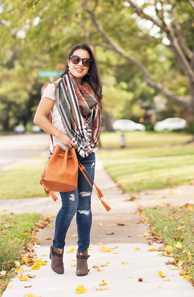 cute & little blog | petite fashion | fall blanket scarf, distressed jeans, tassel bucket bag, ankle boots | fall outfit