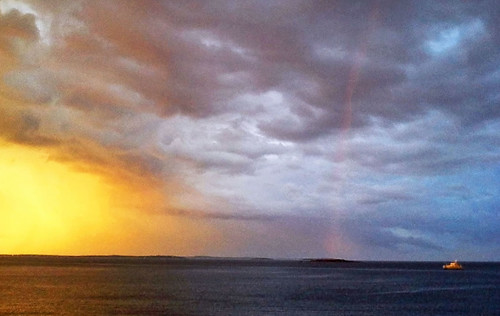 ocean light sunset sea seascape clouds landscape outdoors boat rainbow maine atlantic