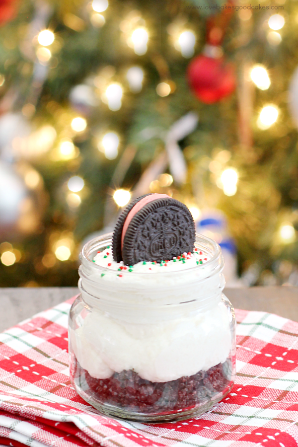 White Chocolate Peppermint Oreo Cheesecake Jars with an OREO cookie on top.