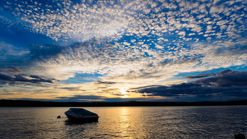 blue sky lake water clouds boat high long peaceful
