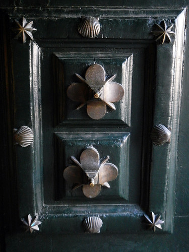 The door of the cathedral in Santiago de Compostela features scallop shells, a symbol of El Camino de Santiago