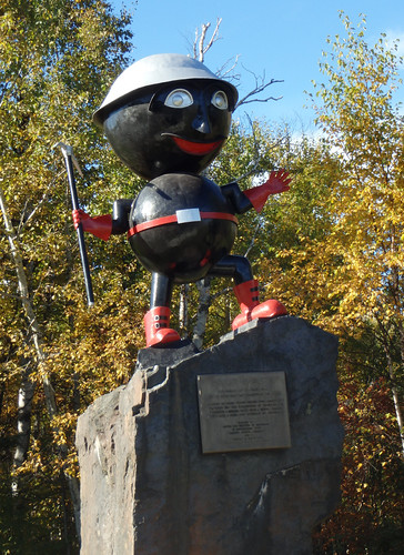 statue that looks like two large taconite balls with arms and legs