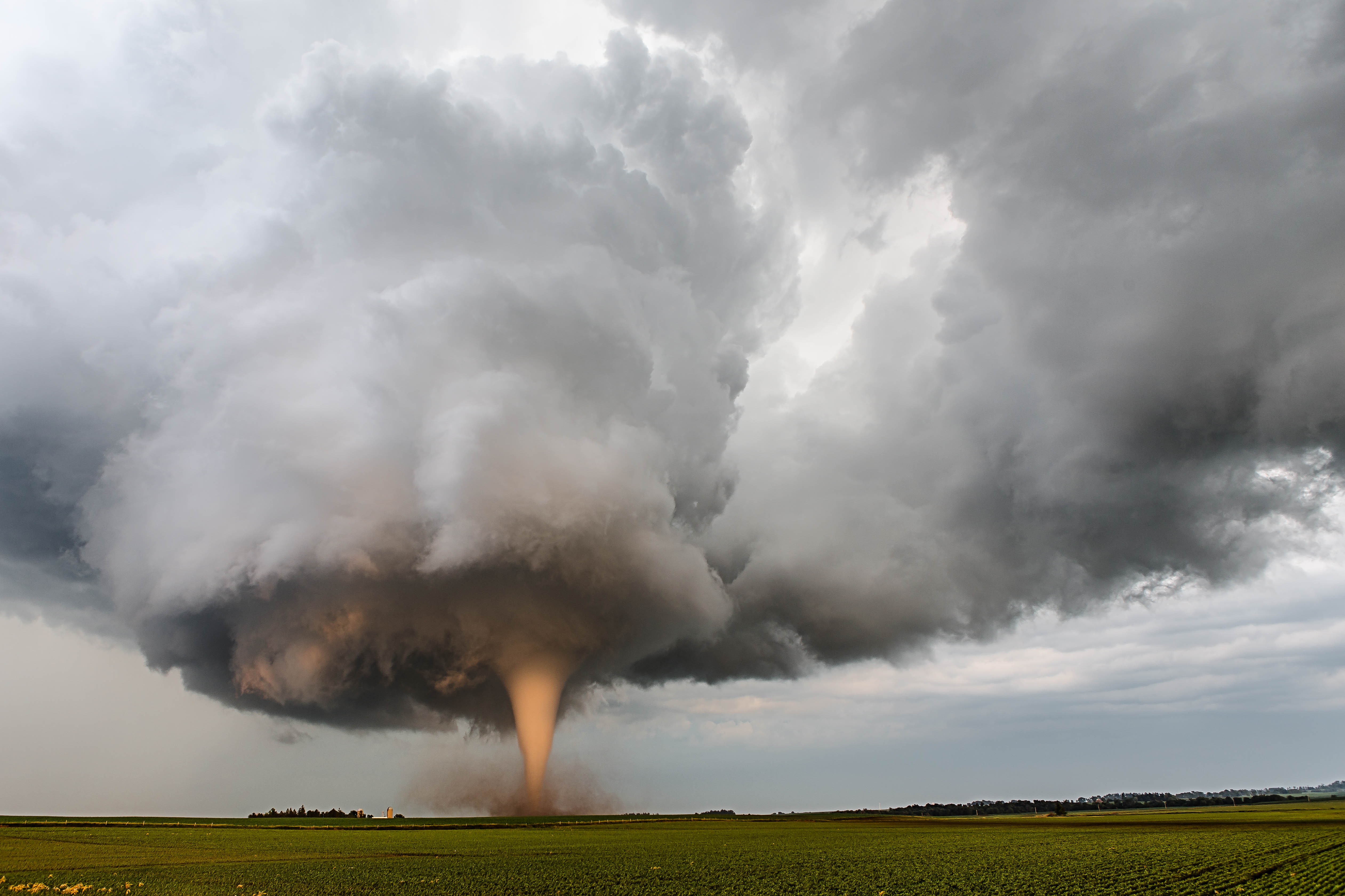 United States of America "A tornado churns up dust in the sunset light