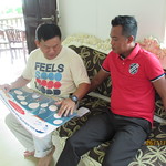 Sim Explaining Poster to the Manager from TAD Marine Resort