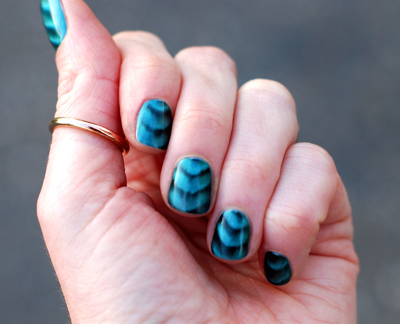 Green and black magnetic nail polish