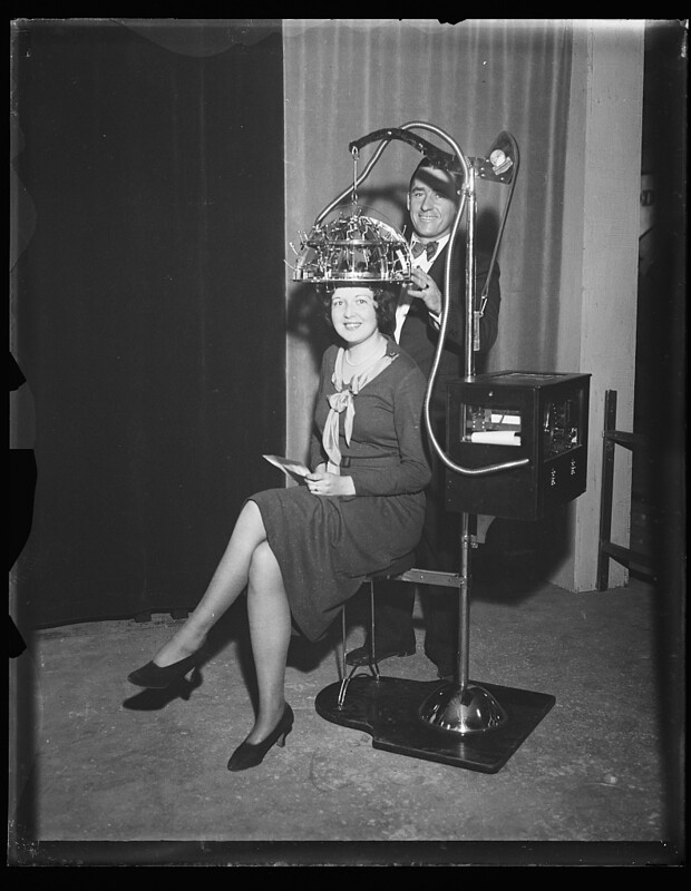 Identified! [Woman seated with a psychograph, a phrenology machine, on her head] (LOC)