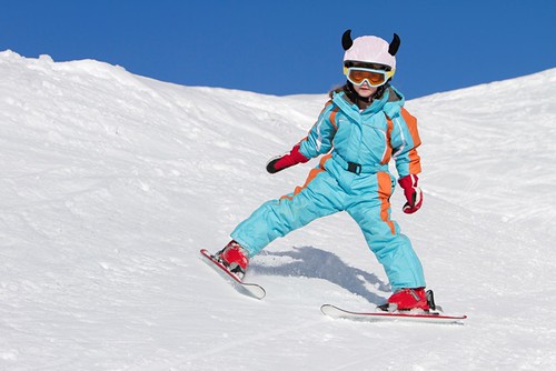 Little girl skiing downhill