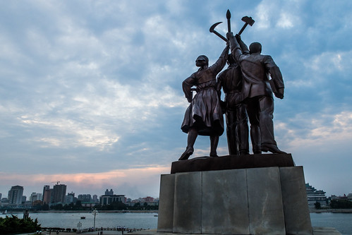 dprk northkorea korea pyongyang statue sunset clouds river city