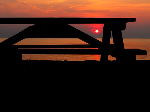morning red orange sun black reflection beach water silhouette sunrise table outdoors