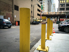 Star Wraps on bright yellow parking poles