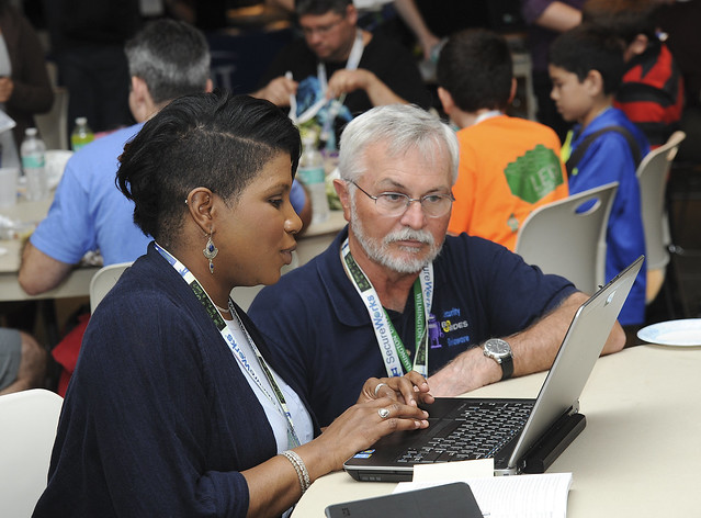 Assistant Professor Tasha Jackson, Chair, MS-IST Information (left) works through a challenge with Associate Professor Dr. Mark Hufe, Director, Cyber Security Education at the BSides 2016 conference held at Wilmington
University.
