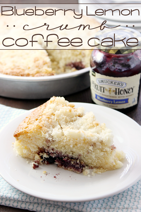 Berry Lemon Crumb Coffee Cake on a white plate with a jar of jelly.