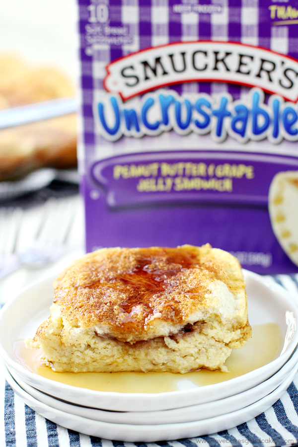 Smuckers Uncrustables in the box. and on a plate with syrup.