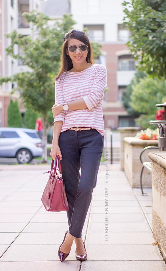 pink striped top, glitter belt, navy pants, oversized watch, burgundy pumps