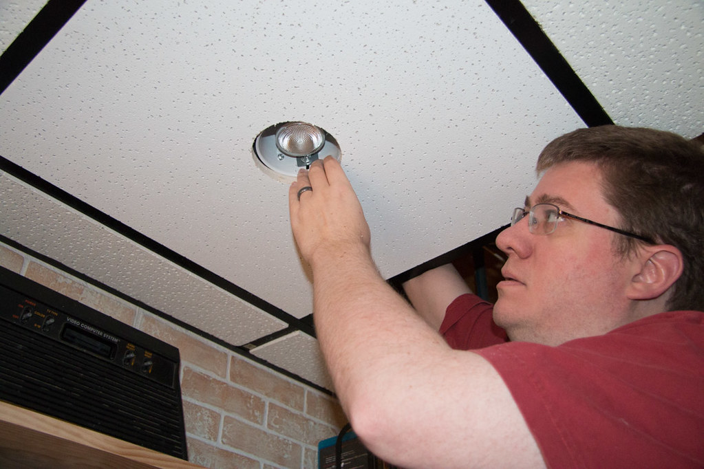Putting cut ceiling tiles back in ceiling around recessed lighting housing