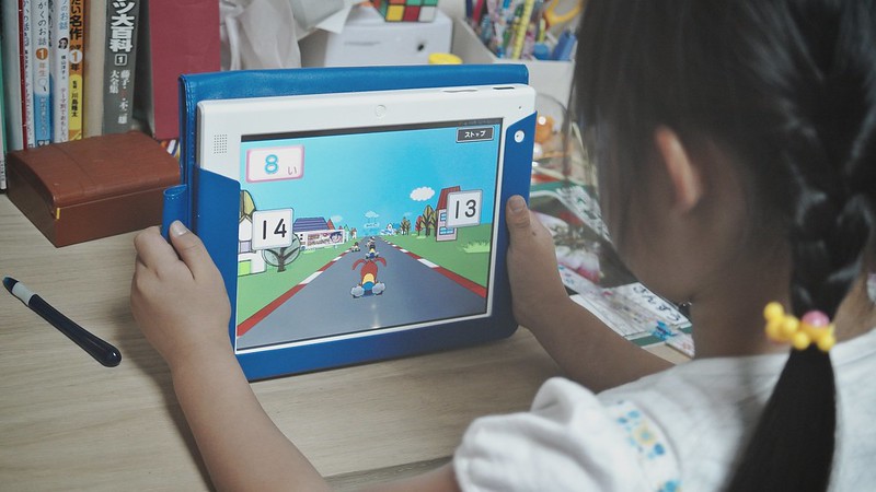 SAKURAKO is using a educational tablet.