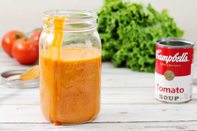 Tomato Soup Salad Dressing in a glass jar with a can of Campbells Tomato soup.
