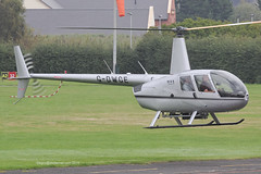 G-DWCE - 2006 build Robinson R44 Raven II, lifting for departure at Barton