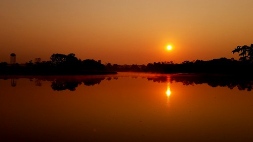 red orange sun lake reflection water sunrise morninglight calm clearsky oldhamcounty