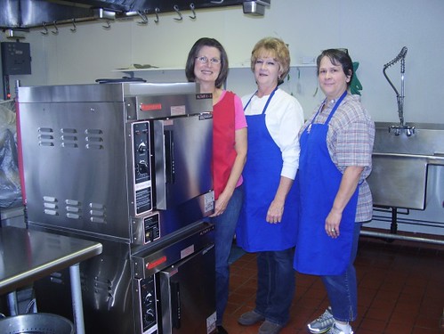 Panguitch Middle School staff posing with their new double deck electric convection oven