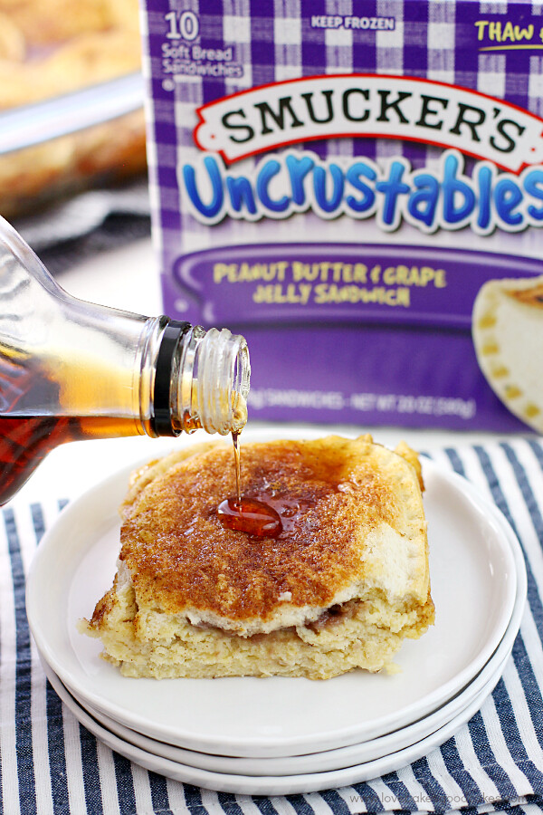 Uncrustables® Overnight French Toast on a plate with syrup.