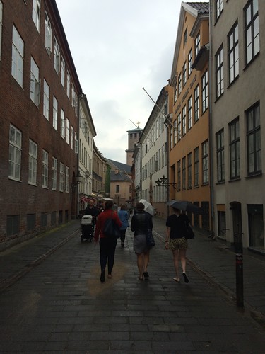 friends walking streets in the rain Copenhagen