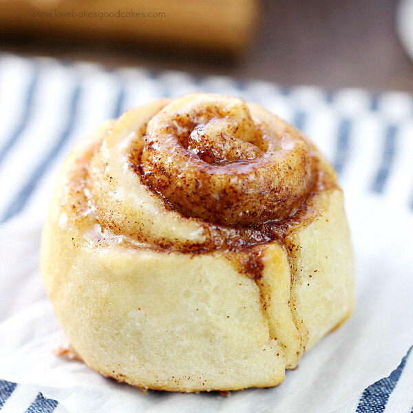 Quick & Easy Cinnamon Rolls close up on parchment paper.
