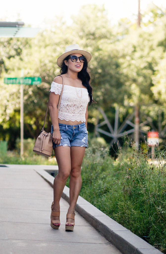 cute & little blog | petite fashion | lace off shoulder crop top, distressed denim shorts, nude wedge sandals, bucket bag, panama hat | summer outfit
