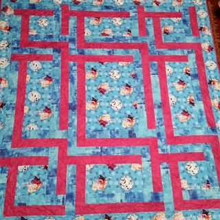 Mikaela's Frozen quilt is bound and on her bed. She'll be excited when she wakes up tomorrow morning.