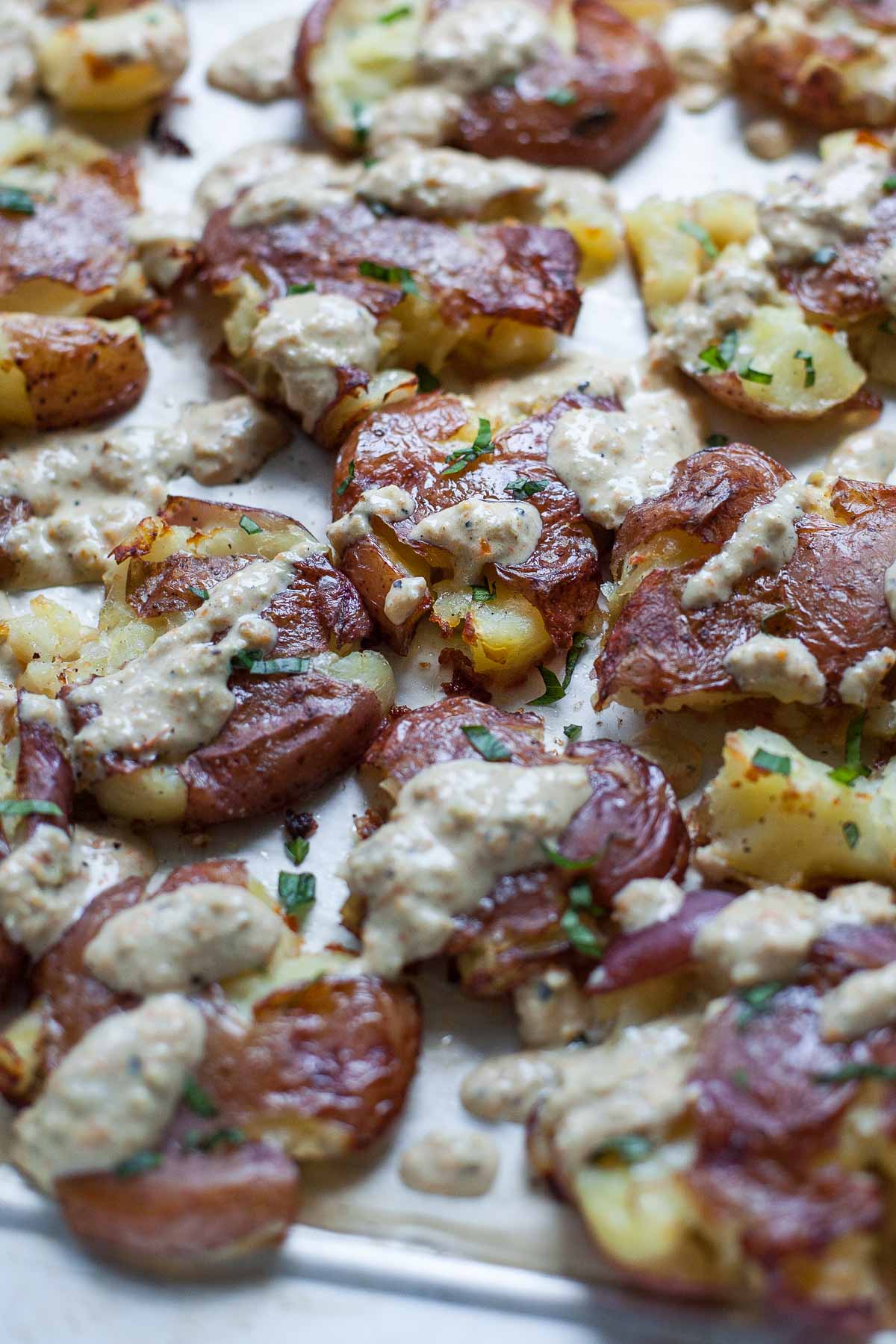 Smashed Potatoes with Hatch Chile Tomatillo Crema | acalculatedwhisk.com