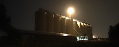Gain silos at night.