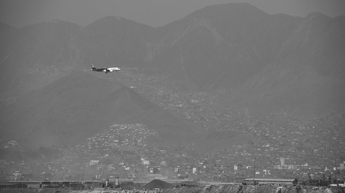 monochrome blackandwhite hills city fog mist buildings cityscape hillscape planescape flightscape plane aircraft beforelanding bright misty whike black peru lanairlines lowcost skyscanner latinamerica aeroplane flight aviation landing sky mountainside mountain mountains view machine beauty day outdoor floating flying lan wheels