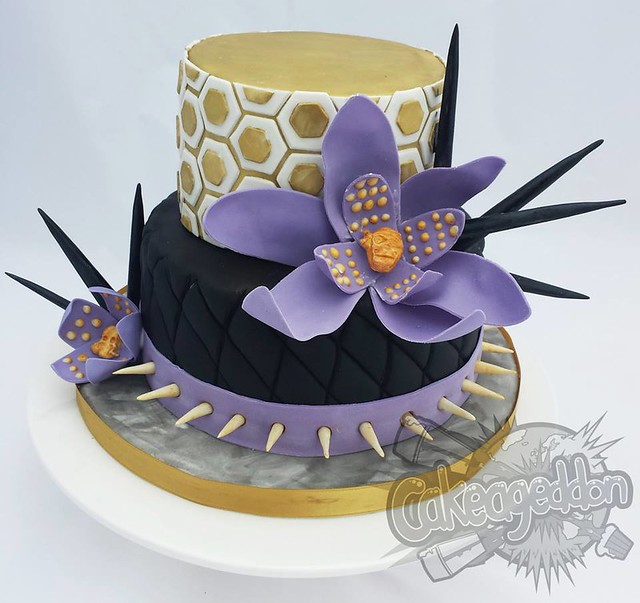 Honeycomb effect top tier with purple skull centred flowers by Cakeageddon